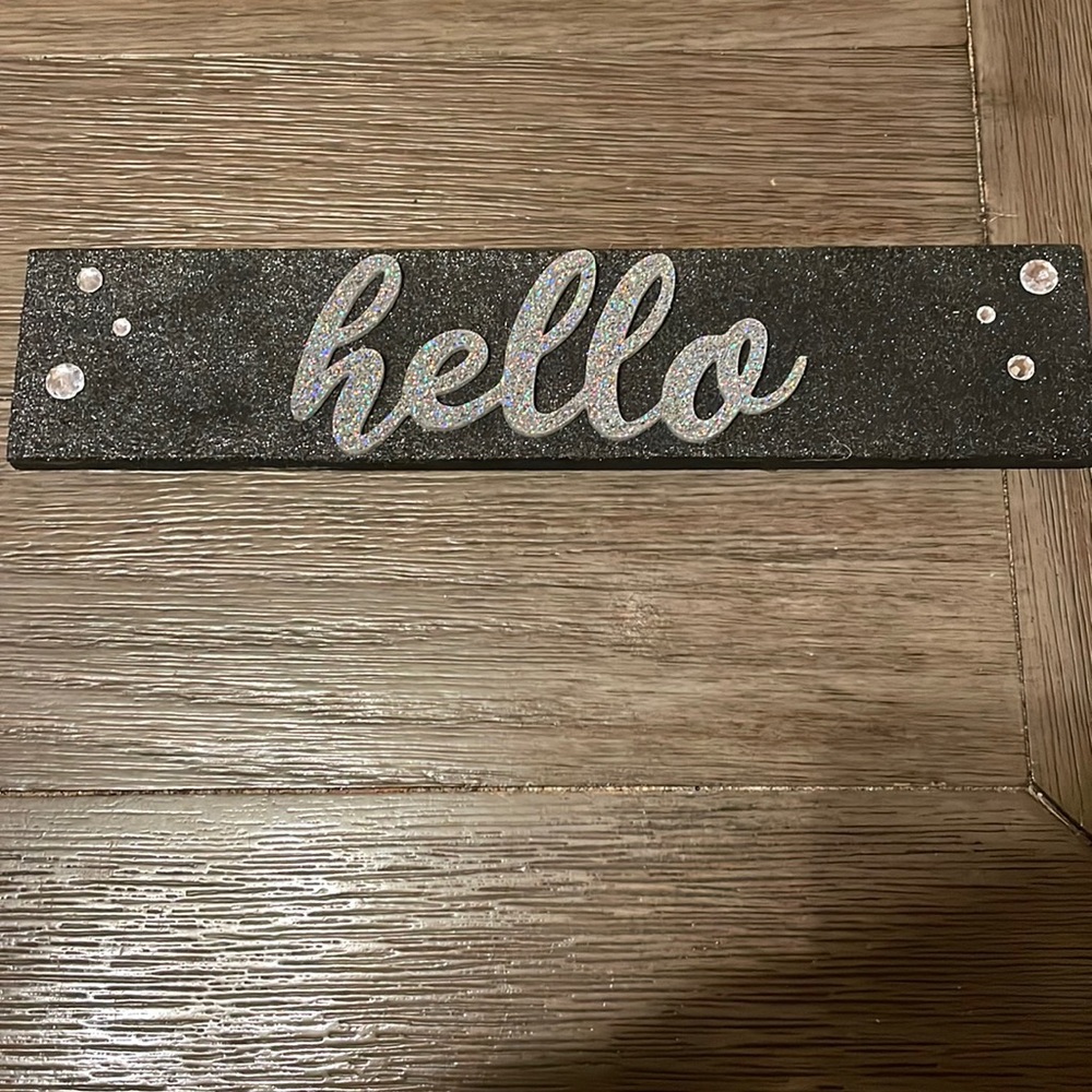 Handmade wooden “Hello” sign with embellishments